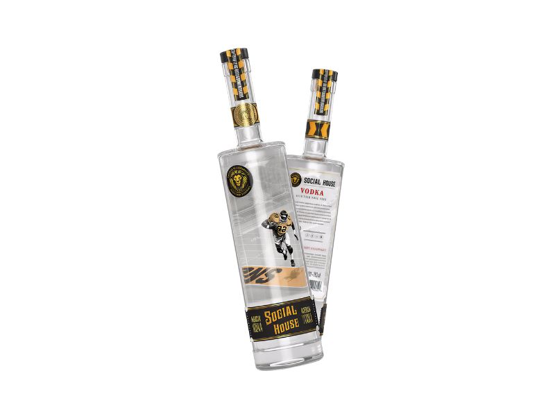 Social House Vodka Two clear glass bottles of Social House vodka, featuring a black and gold sports-themed label with an image of a football player on the front bottle, and the back bottle showing the product details.